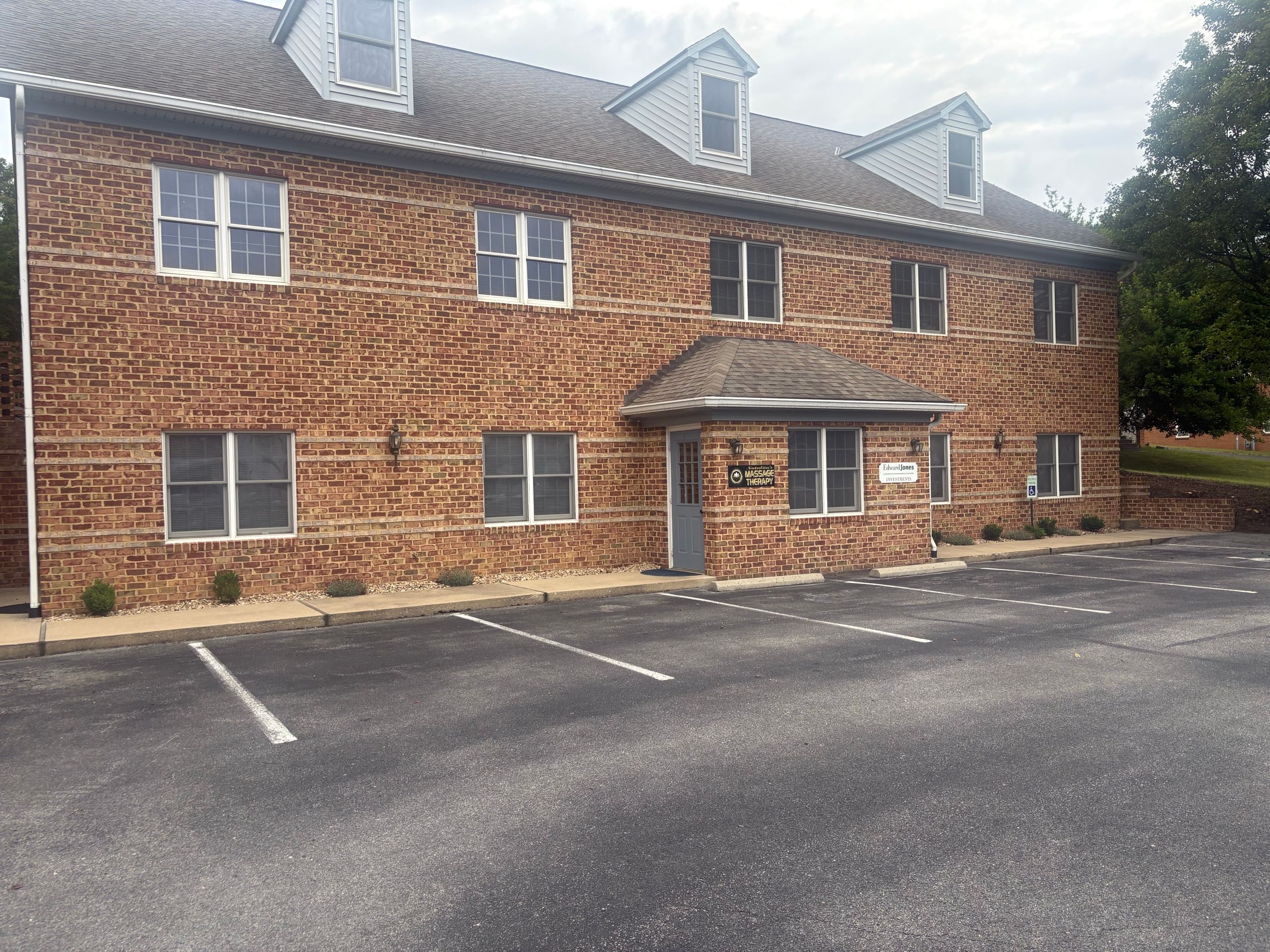 The exterior of Nataliia's Massage Therapy — a brick building with private parking in Staunton, Virginia