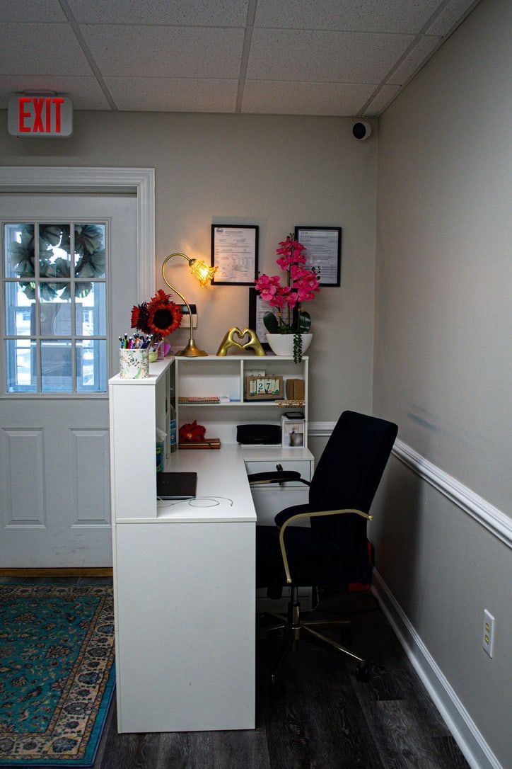 The studio's reception desk and warmly lit front entrance